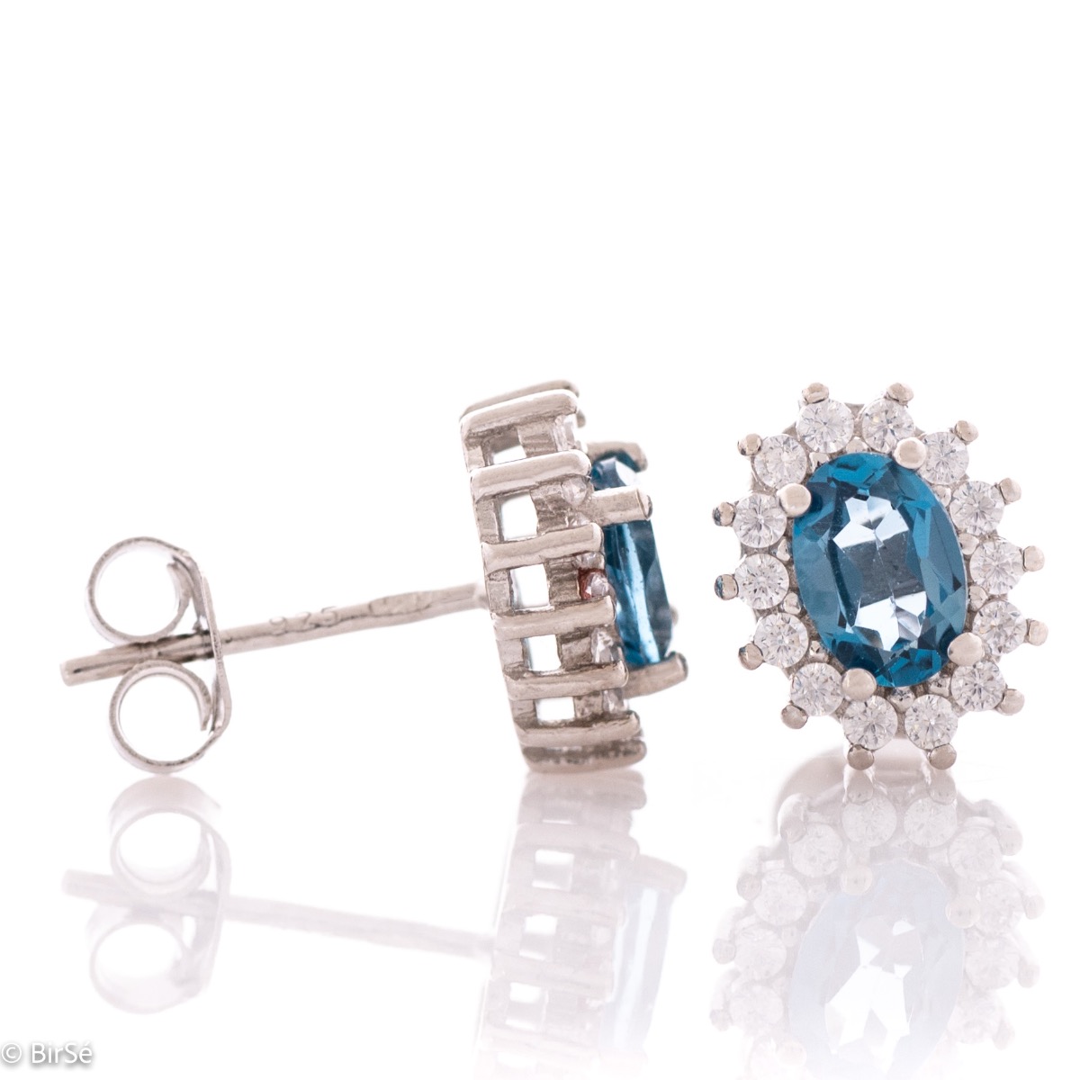 Exquisite women's marquise stud earrings delicately crafted entirely from rhodium-plated silver combined with the glow of a natural London topaz stone surrounded by sparkling zircons.