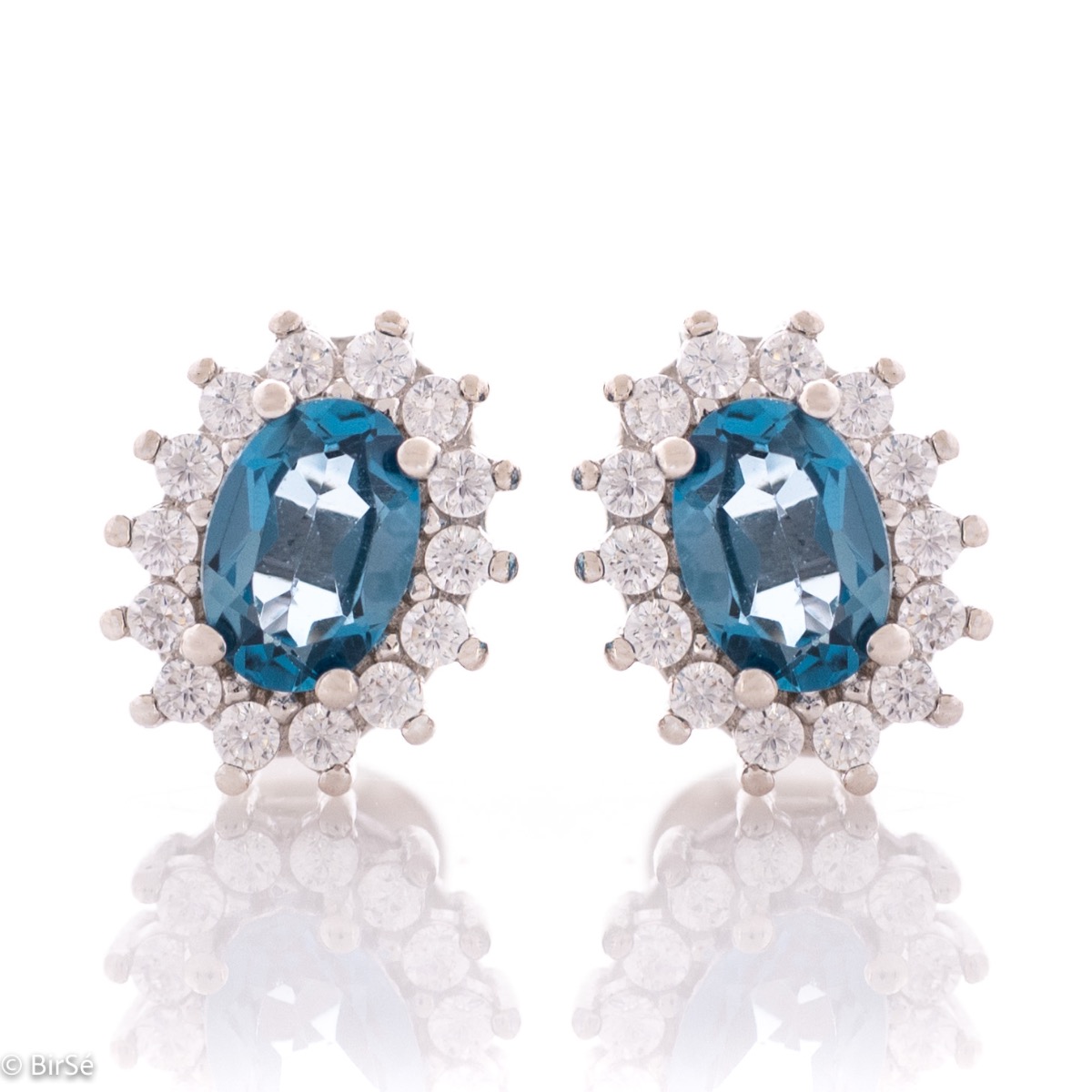 Exquisite women's marquise stud earrings delicately crafted entirely from rhodium-plated silver combined with the glow of a natural London topaz stone surrounded by sparkling zircons.