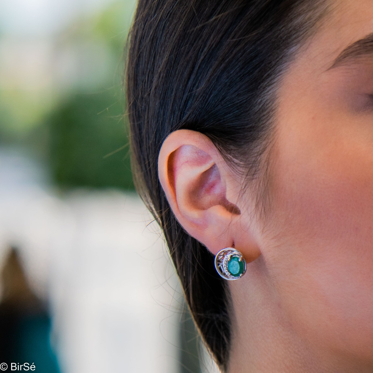 Elegant silver earrings with a modern look and English clasp. Stylish designer craftsmanship from a fine combination of rhodium-plated silver with captivating natural emeralds. Complete with silver pendant and silver ring from the same collection.