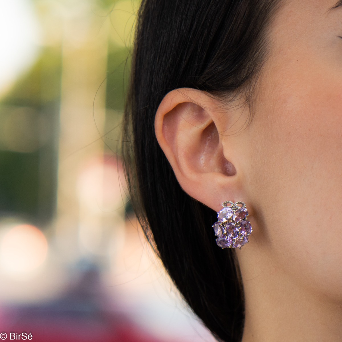 Spectacular earrings with exquisite workmanship entirely of soft rhodium silver combined with the glow of a natural amethyst stone. Part of an exclusive sterling silver three-piece set - with a lovely ring and pendant.