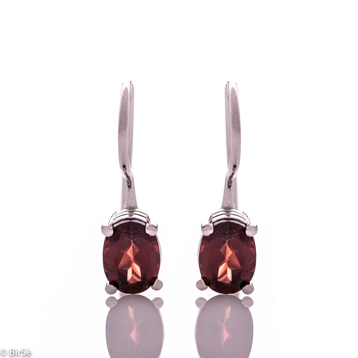 Delicate women's earrings with a clean and precise design combining shiny rhodium silver with radiant natural garnet.