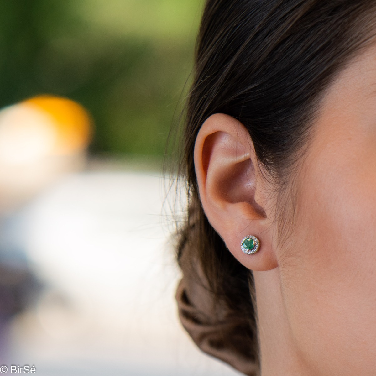 Exquisite beauty - stunning sterling silver earrings with a delicate look and pin fastening. An elegant composition made of a fine combination of rhodium-plated silver with an exquisite emerald and dazzling zircons.