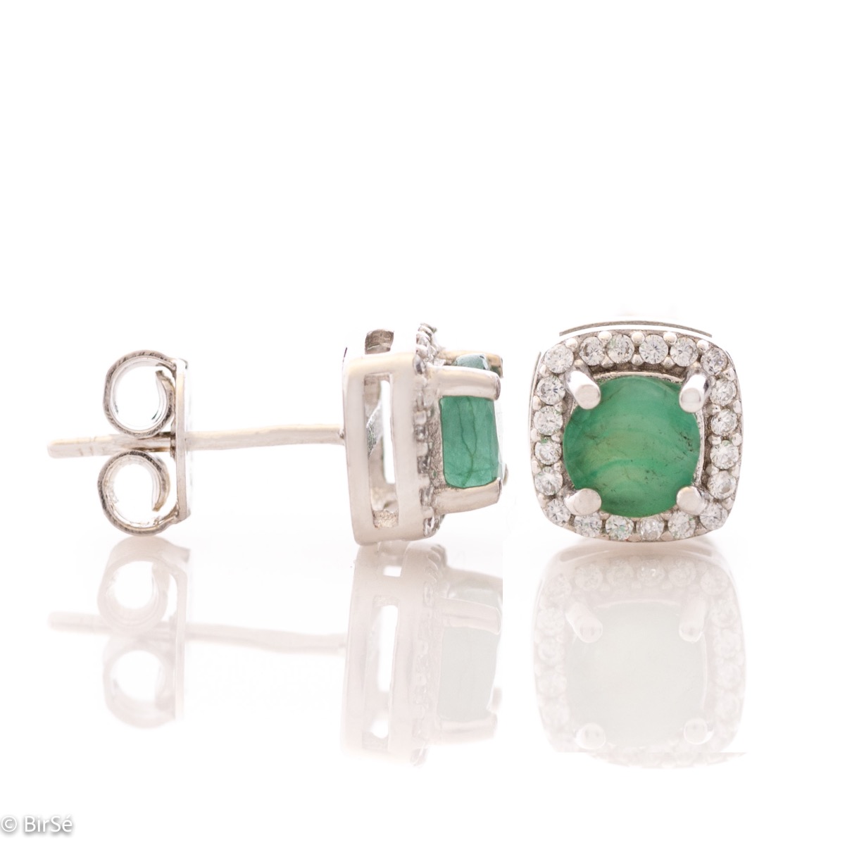 Gentle radiance - our new rhodium silver earrings, intertwining the brilliance of a natural emerald surrounded by delicate zircons.