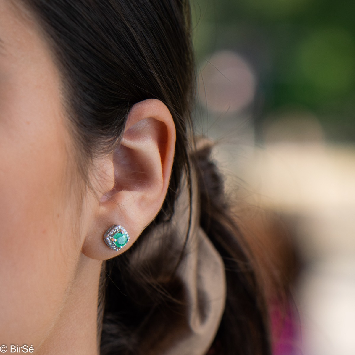 Gentle radiance - our new rhodium silver earrings, intertwining the brilliance of a natural emerald surrounded by delicate zircons.