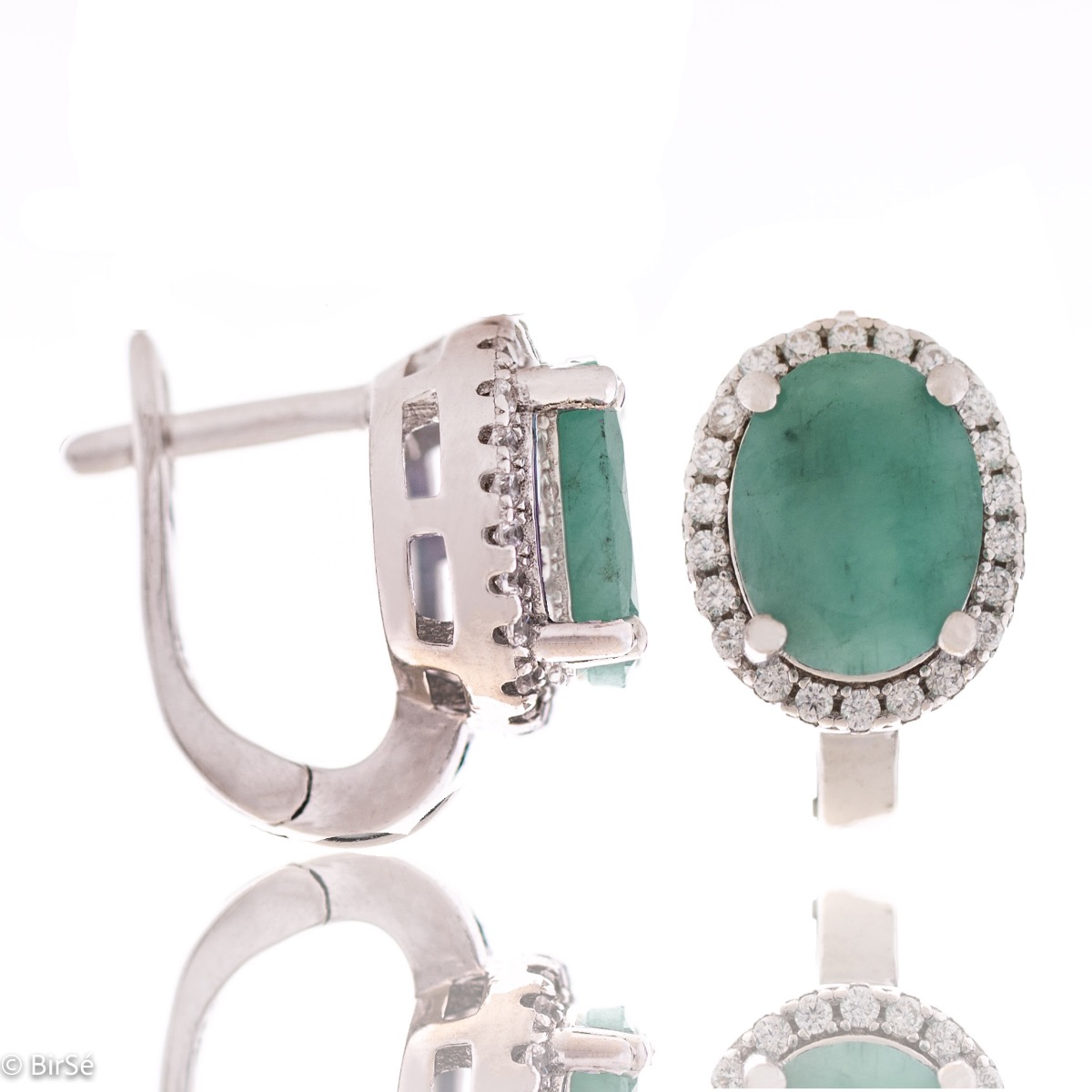 A soft green glow of a natural emerald stone, intertwined with the sparkle of fine zircons and a pattern of rhodium silver - our new women's English clasp earrings. In a charming set with matching ring and necklace.