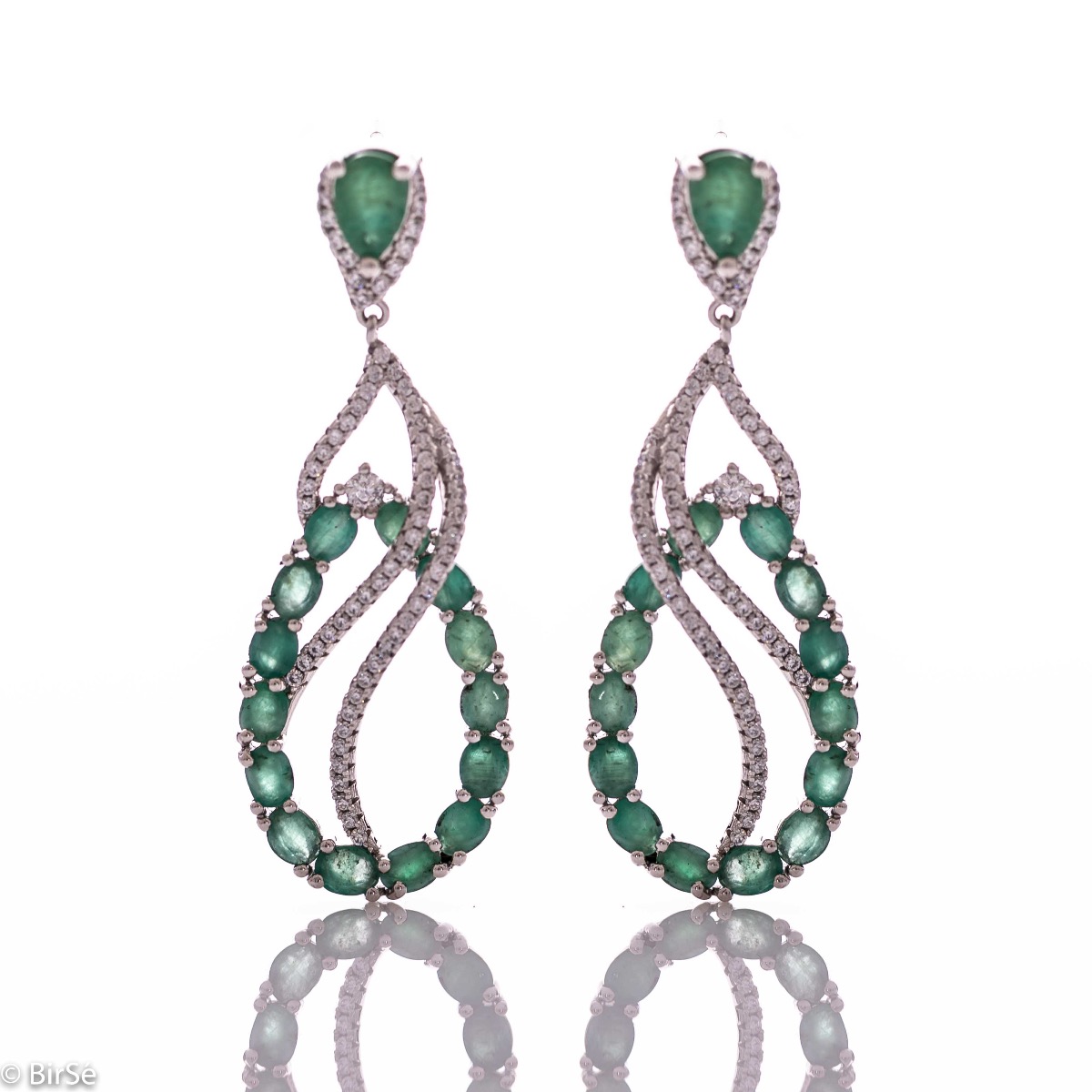 Dangling women's earrings with exceptional craftsmanship combining delicate rhodium silver with numerous and radiant natural stones emerald and zircons.