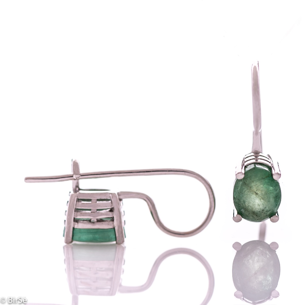 Delicate women's earrings with a clean and precise design combining shiny rhodium silver with a radiant natural emerald.