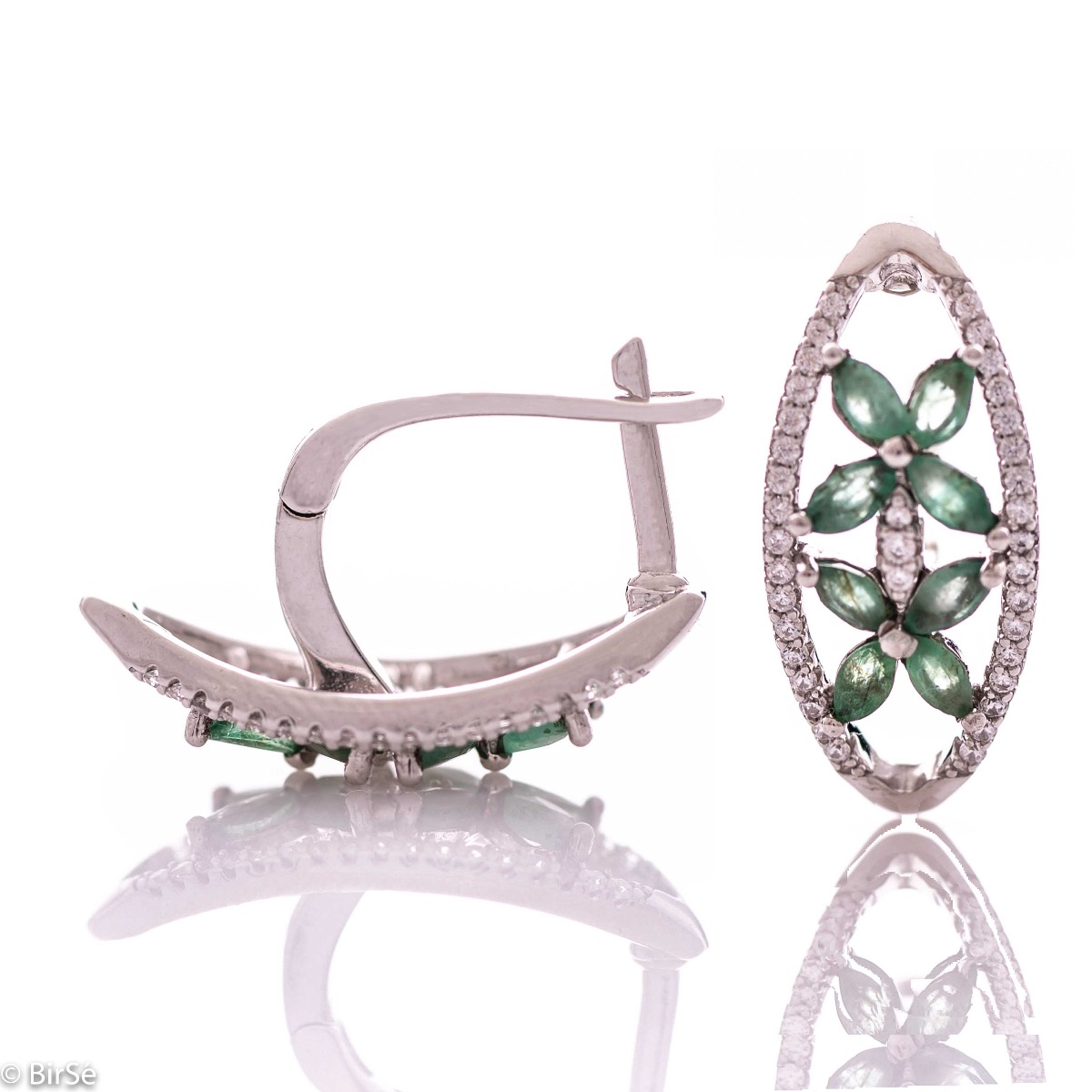 Spectacular women's earrings with exquisite workmanship entirely of rhodium-plated silver, combined with delicate flowers of natural emerald and sparkling zircons. They can be combined with a ring and pendant of the same model.