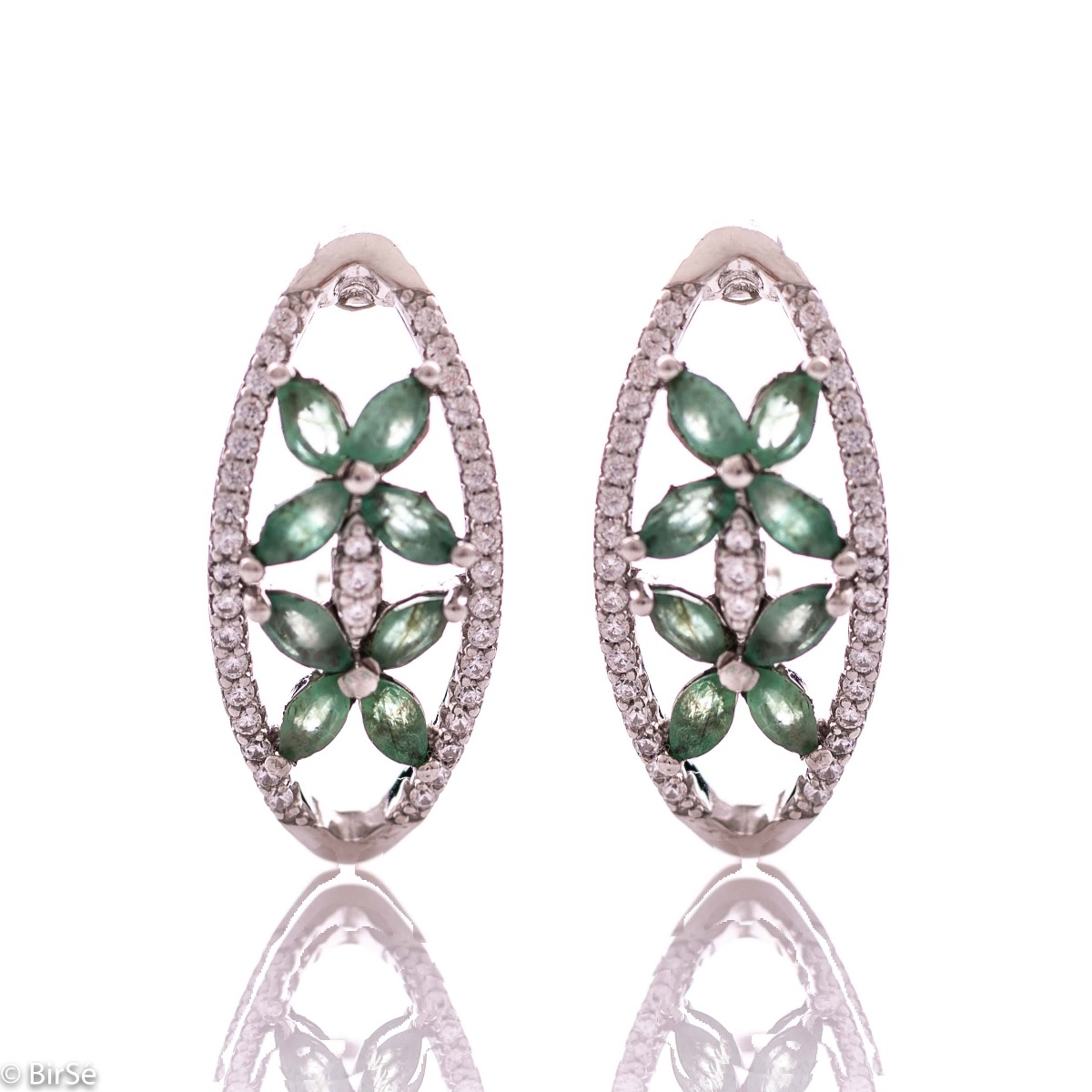 Spectacular women's earrings with exquisite workmanship entirely of rhodium-plated silver, combined with delicate flowers of natural emerald and sparkling zircons. They can be combined with a ring and pendant of the same model.