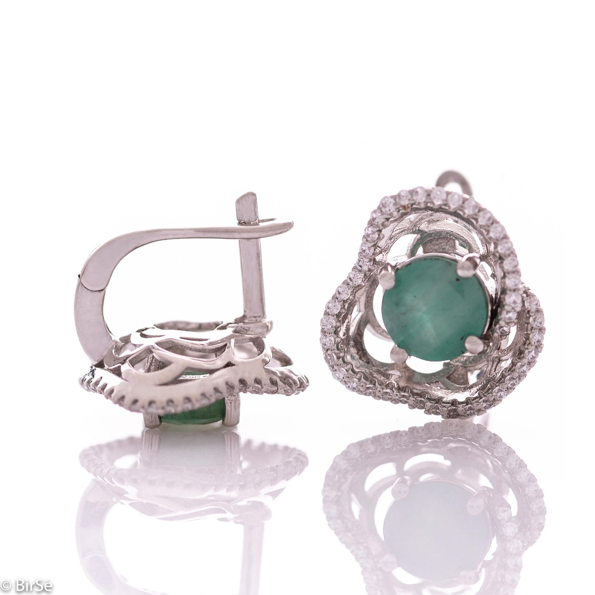 Elegant women's earrings with English clasp and exquisite workmanship entirely of rhodium-plated silver complemented by the glow of natural emerald and sparkling zircons. They can be combined with a ring and pendant of the same model.