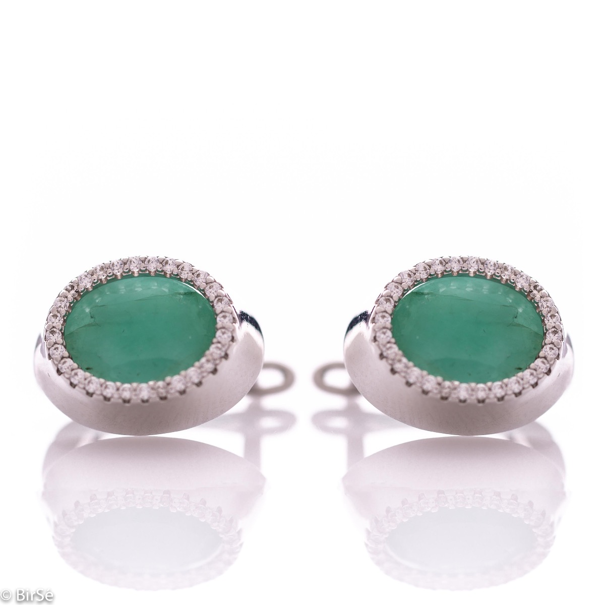 elegant women's earrings with an English clasp and a classic design combining a radiant natural emerald surrounded by sparkling zircons with delicate rhodium silver. They can be combined with a ring and pendant of the same model.