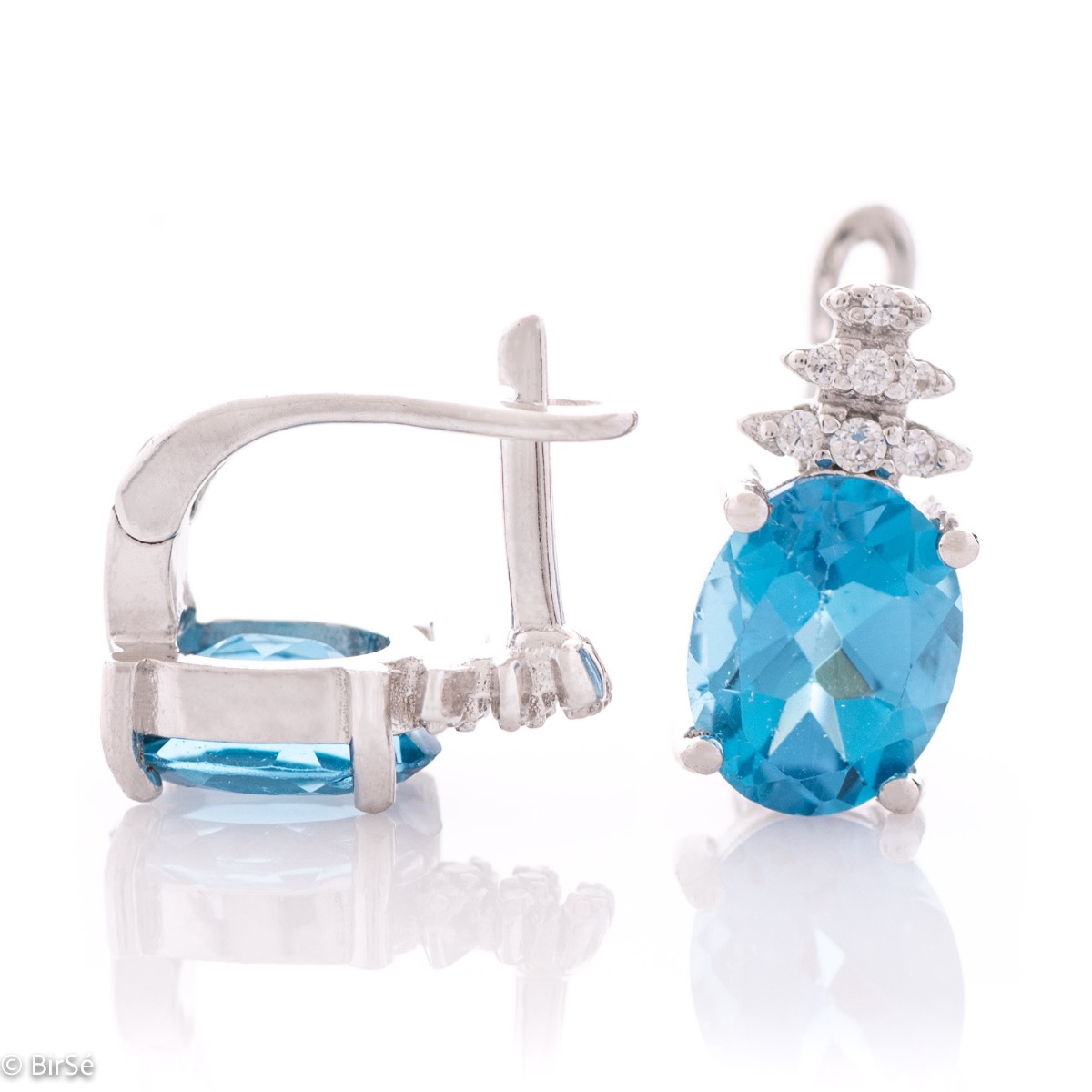 Spectacular ladies' earrings with English clasp and delicate interweaving of radiant natural London topaz with glittering rhodium silver and fine zircons.