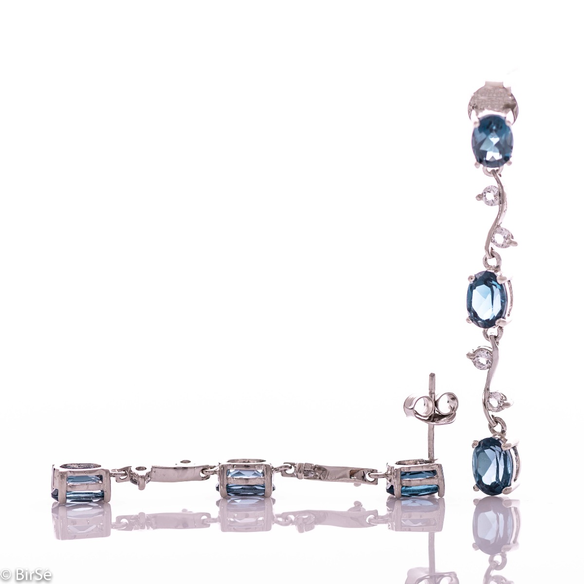 Extremely impressive dangling earrings with delicate workmanship combining numerous natural stones London topaz with shiny rhodium silver.