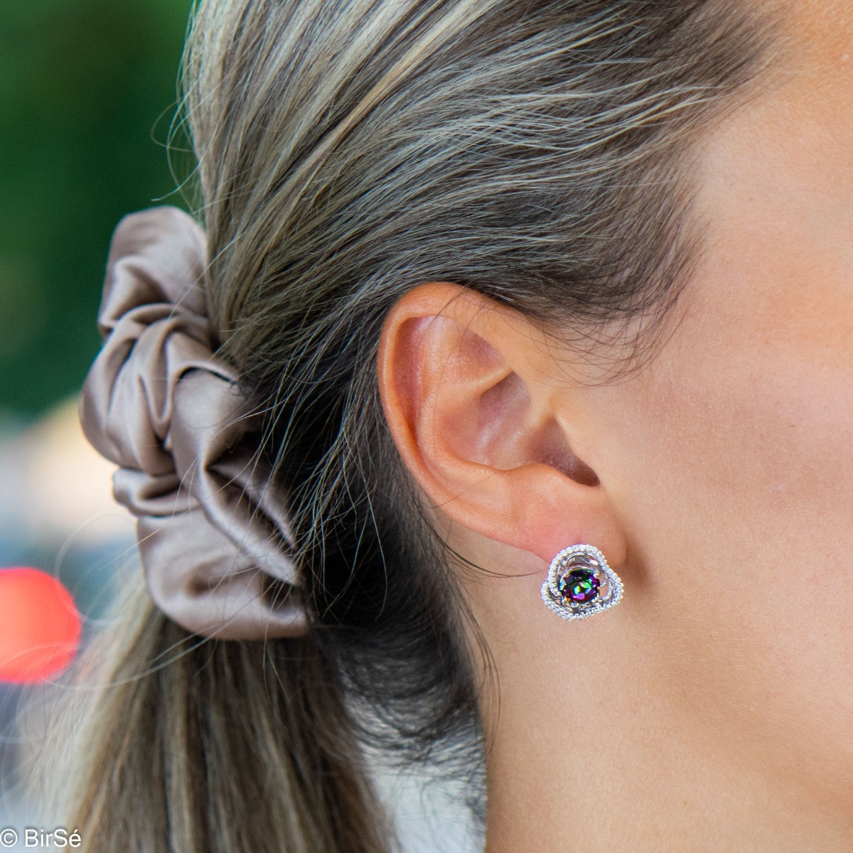 Delicate ladies' earrings with an English clasp and a spectacular rose shape, made entirely of rhodium-plated silver, combined with a natural mystical topaz stone and sparkling zircons.