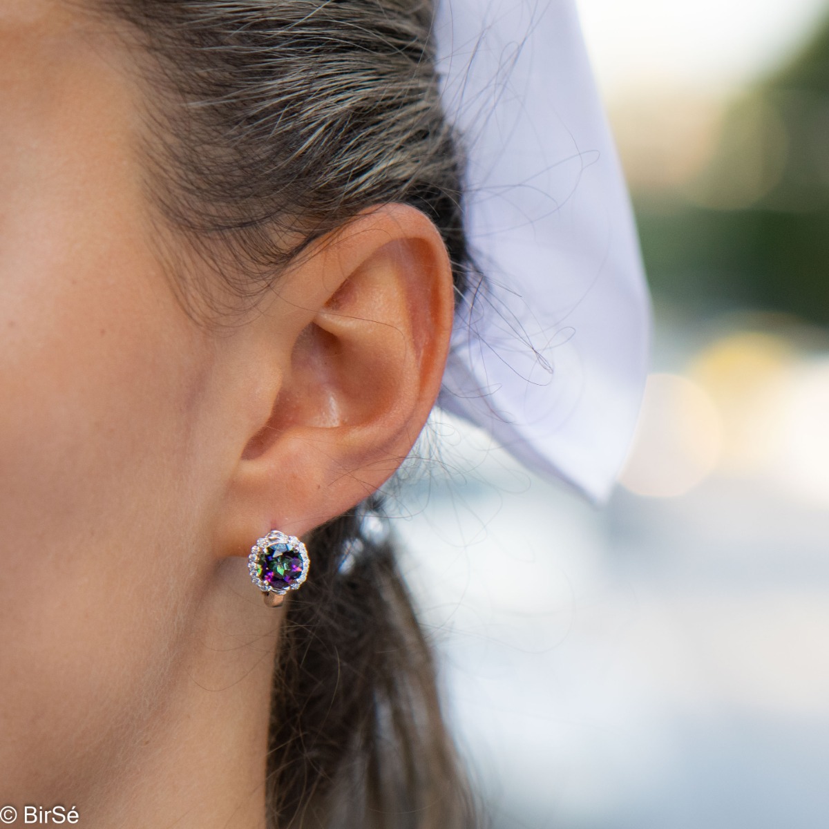 Feel the magic of iridescent Northern Lights in the exquisite Mystic Topaz earrings, gently enveloped in the sparkle of cubic zirconia. Be irresistible with the complete set, including an elegant ring and a delicate pendant.