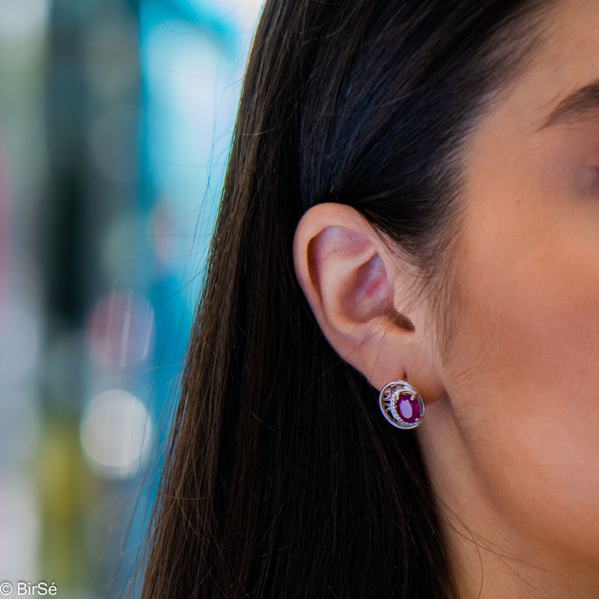 Elegant silver earrings with a modern look and English clasp. Stylish designer craftsmanship from a fine combination of rhodium-plated silver with captivating natural rubies. Complete with silver pendant and silver ring from the same collection.