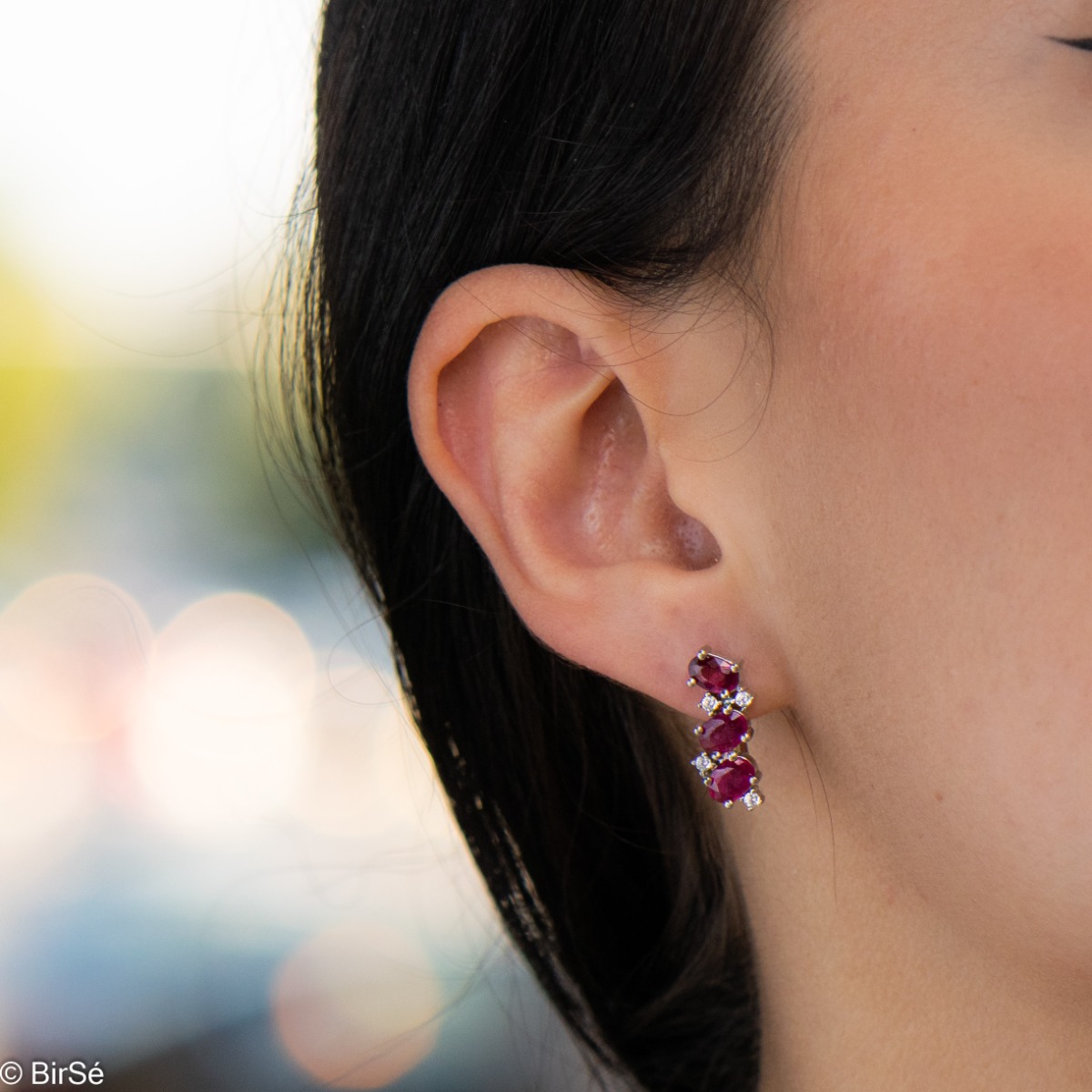 Exquisite craftsmanship of our new English clasp earrings in a beautiful shape and curves, combining numerous and different natural ruby ​​stones, surrounding delicate zircons.