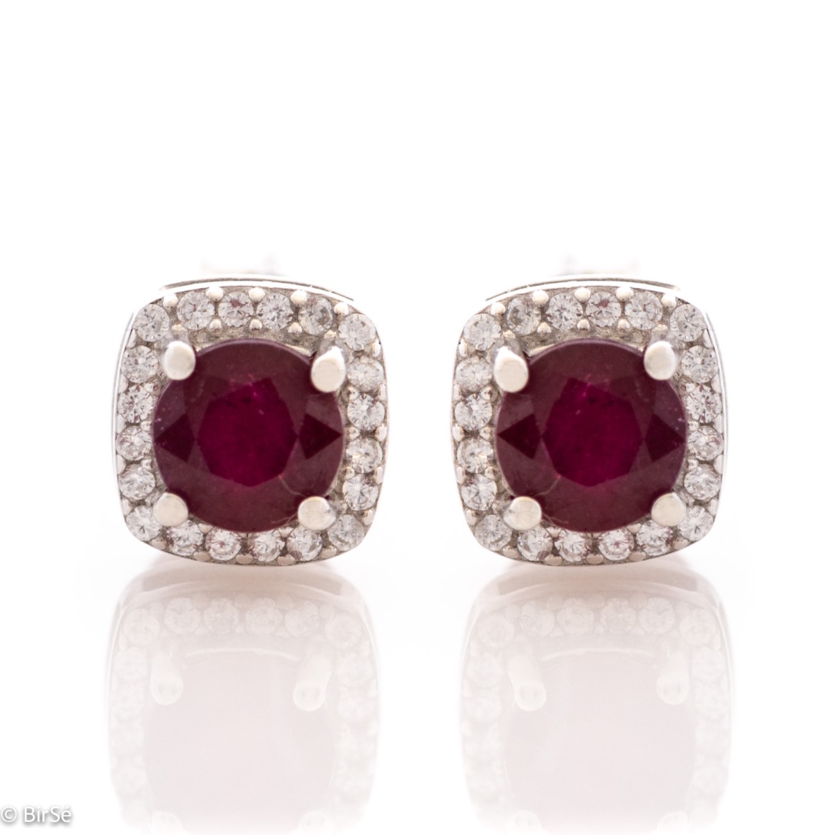 Unique and radiant women's stud earrings with delicate workmanship entirely of rhodium-plated silver and a spectacular shape of a small square of natural ruby ​​and sparkling zircons. Part of an exclusive ring and pendant set.