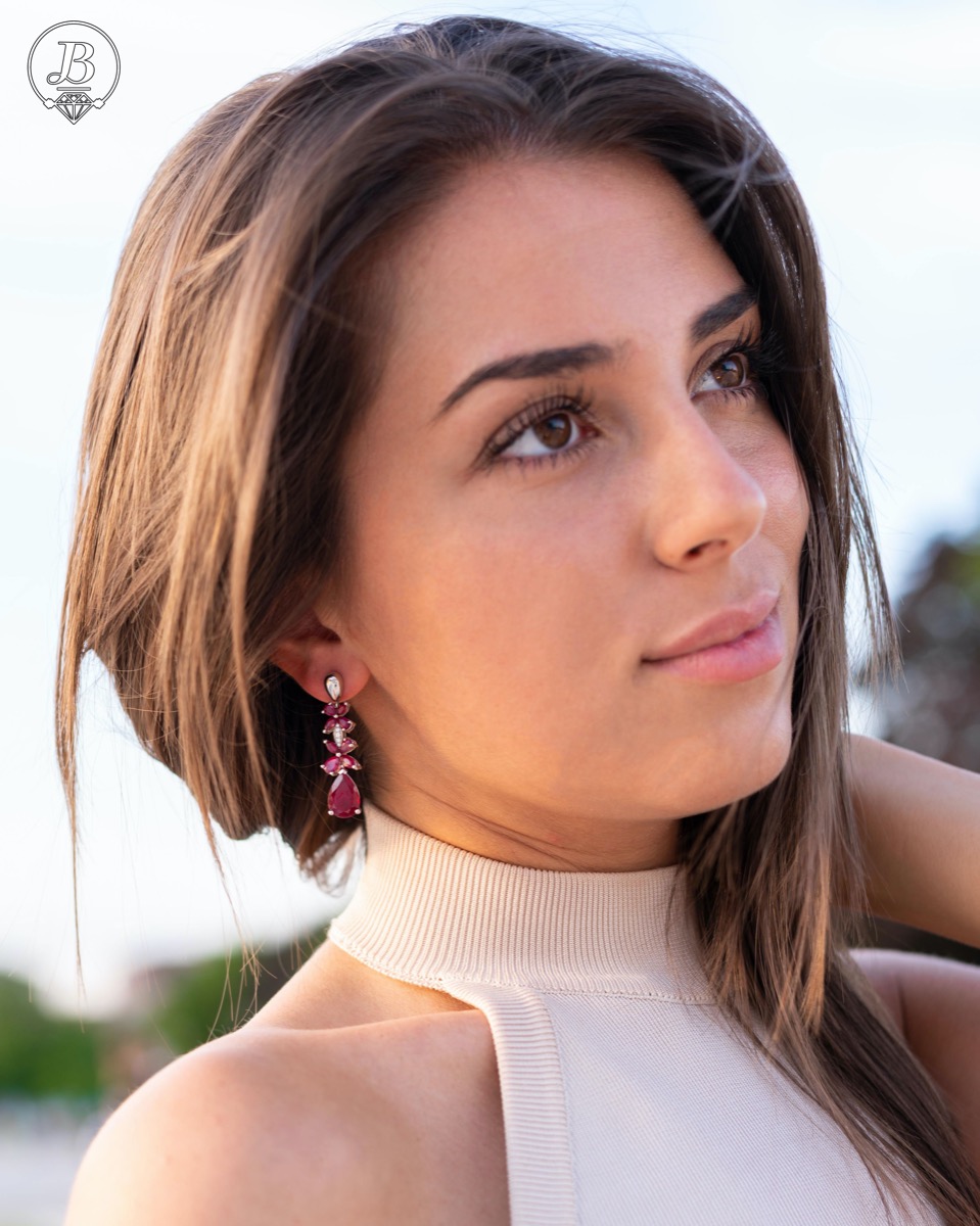 Exquisite silver earrings with precise craftsmanship combining rhodium-plated silver with delicate flowers of natural ruby ​​stone.