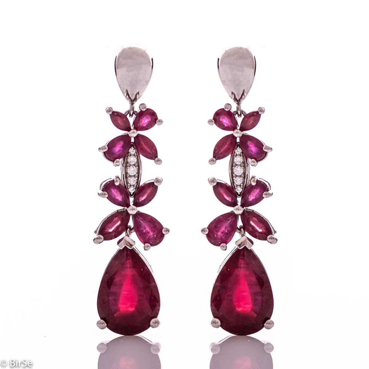 Exquisite silver earrings with precise craftsmanship combining rhodium-plated silver with delicate flowers of natural ruby ​​stone.