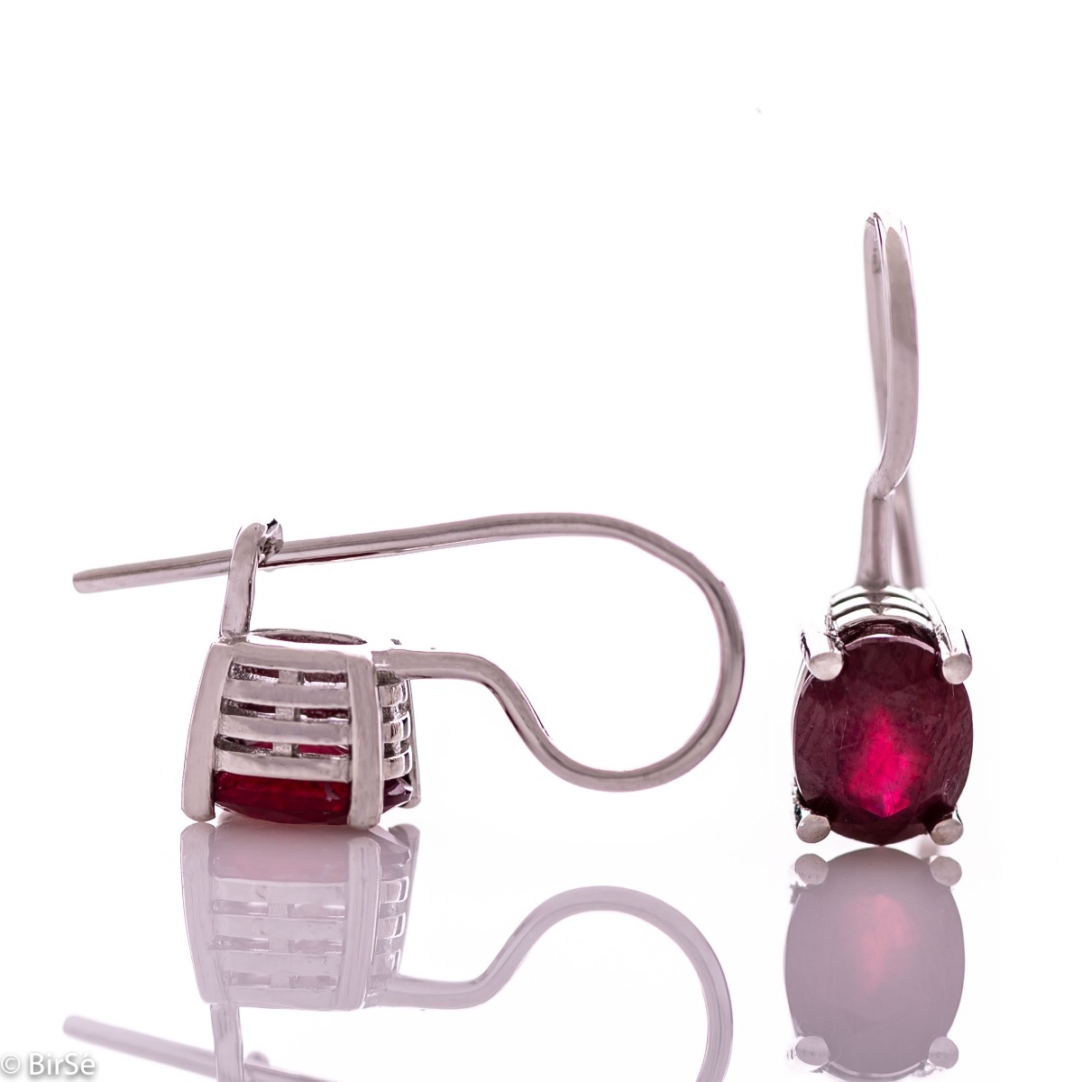 Delicate women's earrings with a clean and precise design combining shiny rhodium silver with a radiant natural ruby.