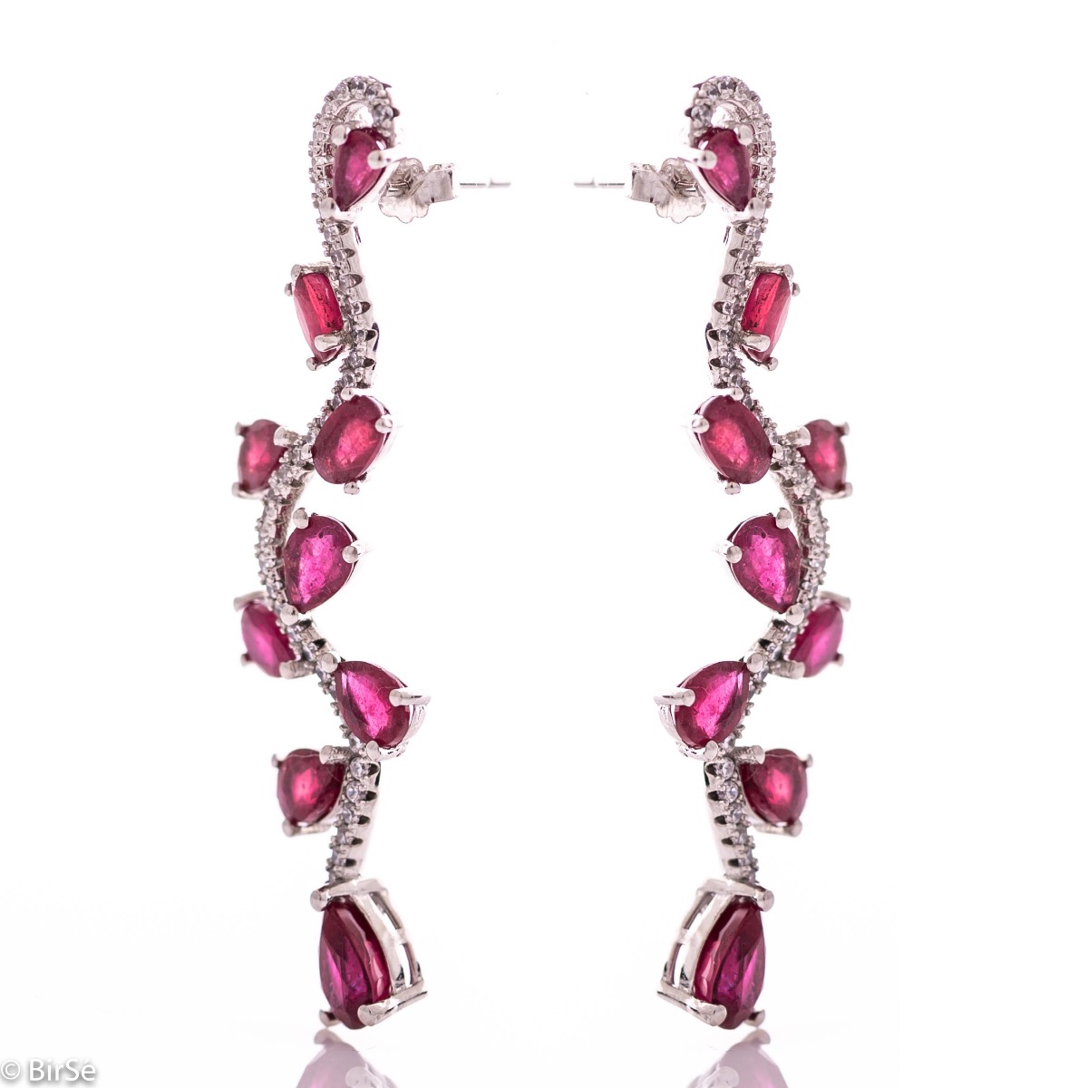 Dangling women's earrings on a pin with exquisite workmanship combining delicate rhodium silver with numerous natural ruby ​​stones and sparkling zircons.