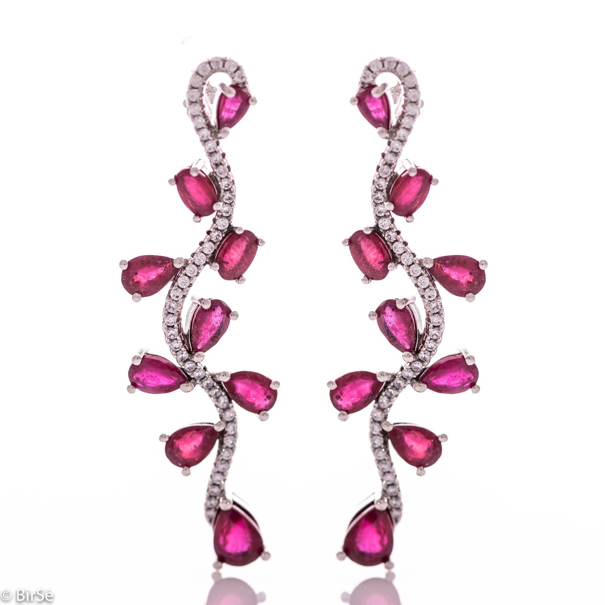 Dangling women's earrings on a pin with exquisite workmanship combining delicate rhodium silver with numerous natural ruby ​​stones and sparkling zircons.