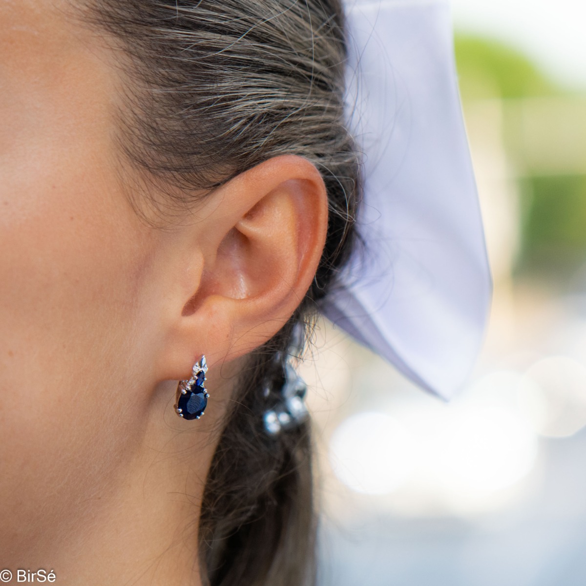 Add style to your look with the elegant design of rhodium silver earrings with natural sapphire. They suit any face type, hair color and you can match them with a ring and pendant from the same collection.