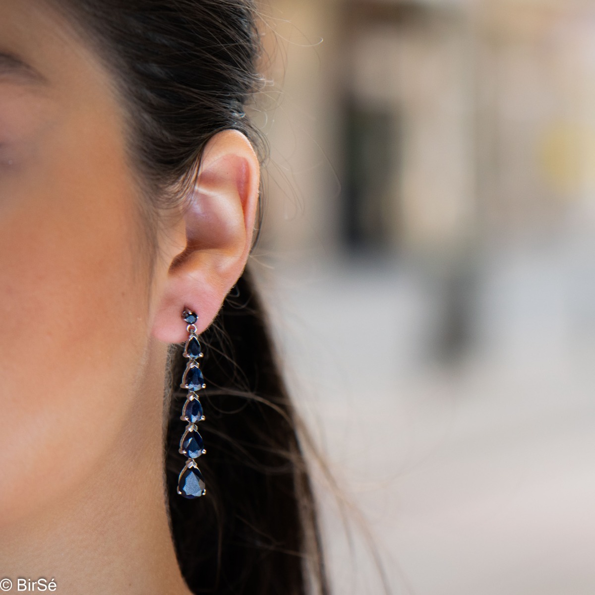 Beautiful and dazzling, rhodium silver and natural teardrop sapphire earrings will add sophisticated style to your look.