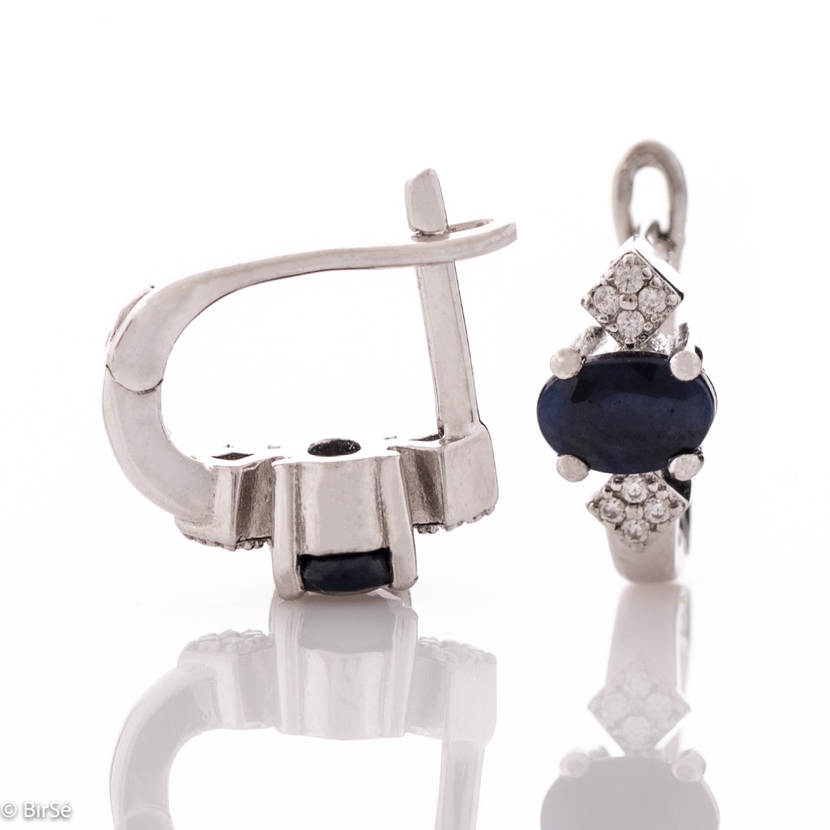 Elegant women's earrings with an English clasp and an exclusive design, combining a scorching natural sapphire stone with a sparkling zircon and made entirely of delicate rhodium silver.