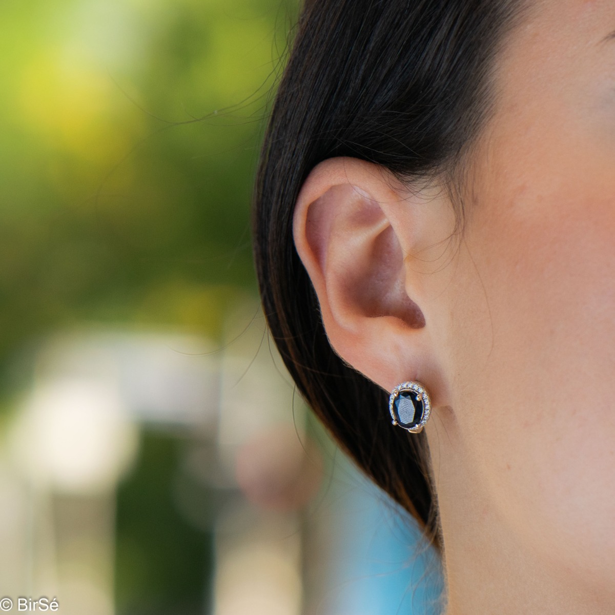 Unique women's earrings with English fastening and a spectacular combination of natural sapphire with sparkling zircons and captivating workmanship entirely from rhodium-plated silver. In an elegant set with a ring and necklace of the same model.