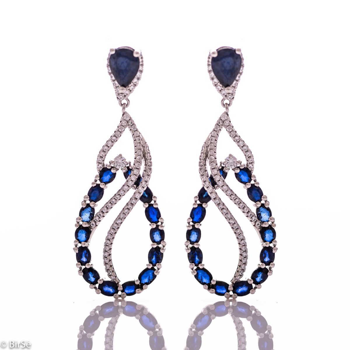 Women's dangling earrings with exceptional workmanship combining delicate rhodium silver with numerous and radiant natural sapphire and zircon stones.