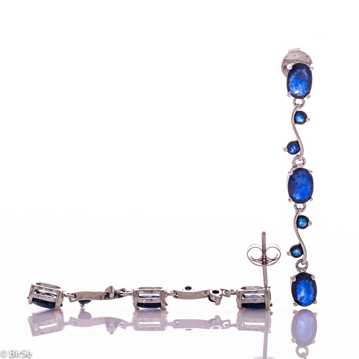 Extremely impressive dangling earrings with delicate workmanship combining numerous natural sapphire stones with shiny rhodium silver.