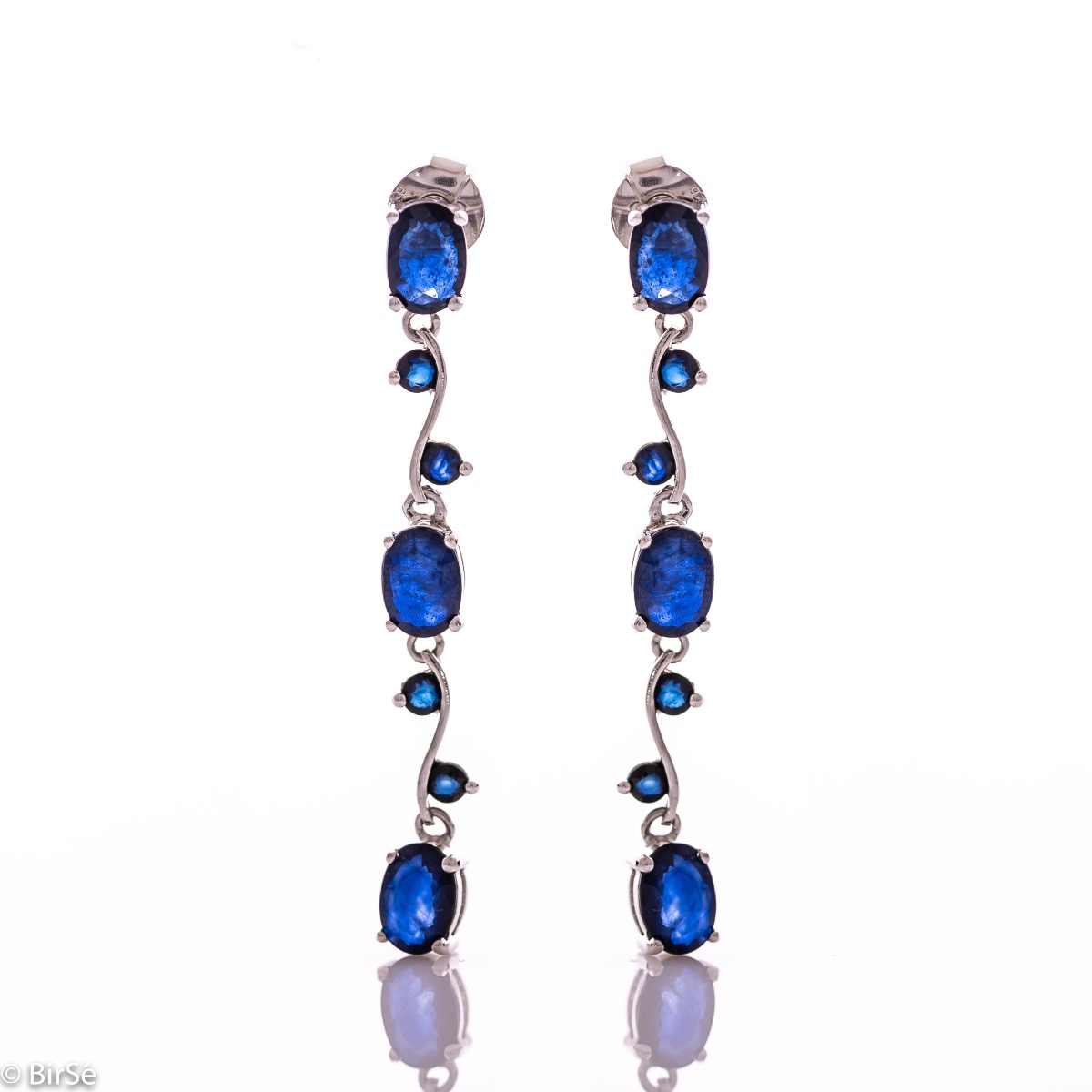 Extremely impressive dangling earrings with delicate workmanship combining numerous natural sapphire stones with shiny rhodium silver.