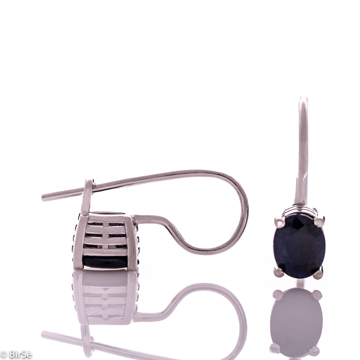 Delicate women's earrings with a clean and precise design combining shiny rhodium silver with radiant natural sapphire.