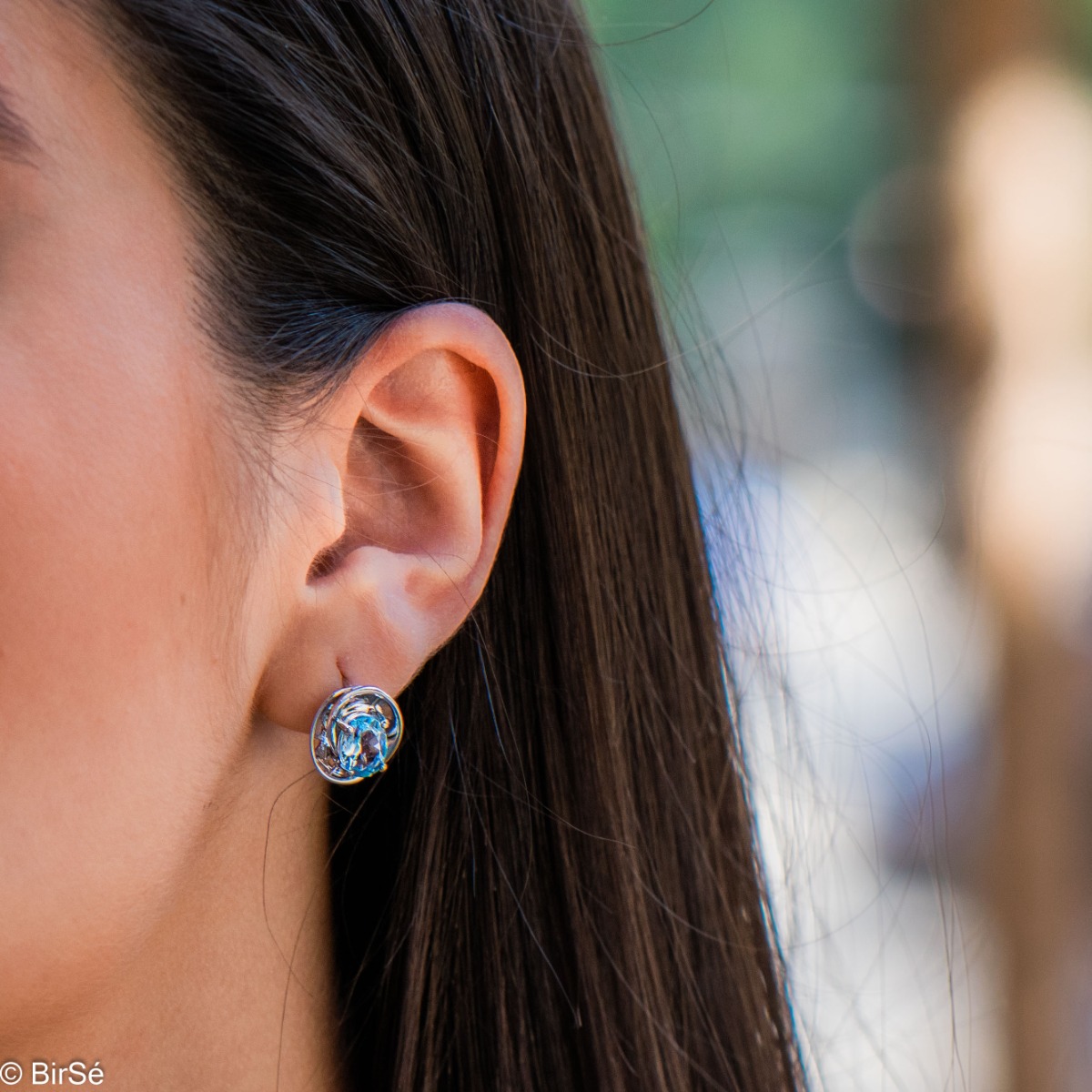 Dazzling rhodium-plated sterling silver and natural blue topaz earrings in an oval shape, encased in delicate hardware with an exquisite design. Make your look even more spectacular with a pendant and ring from the same collection.