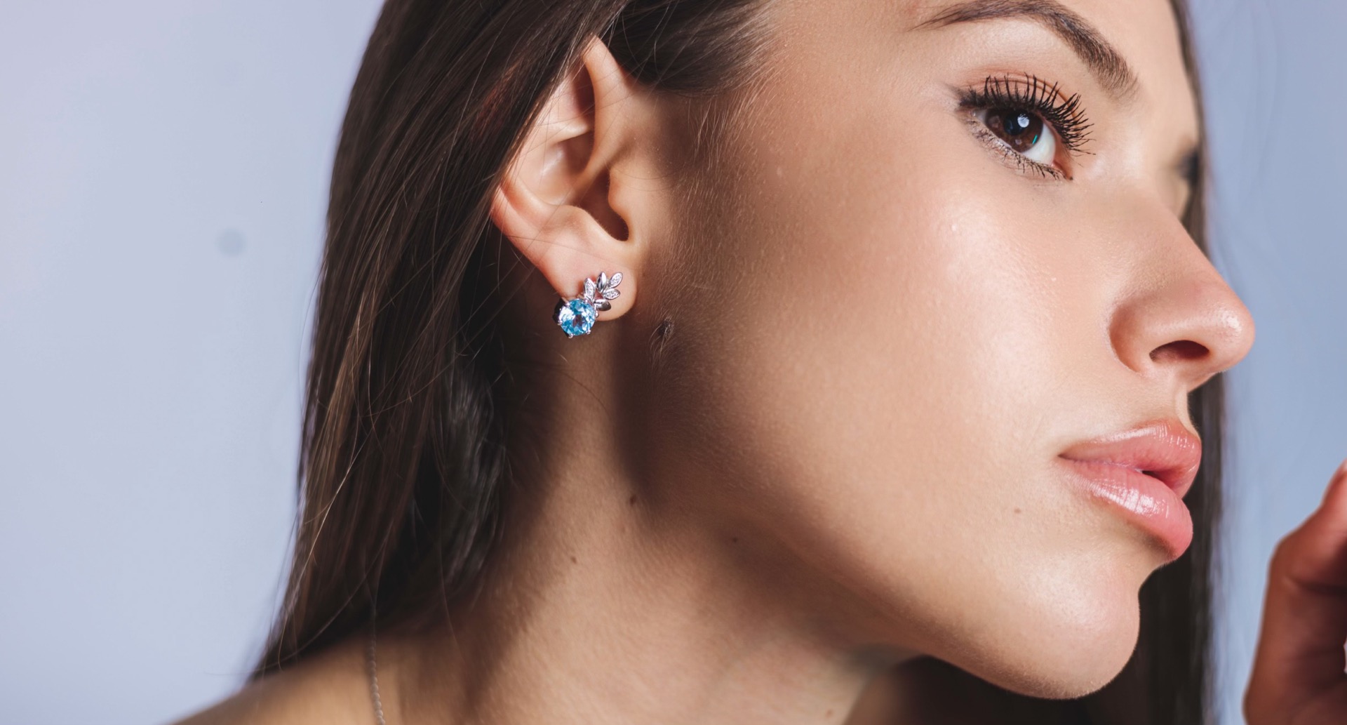 Charming earrings with exquisite design in pineapple shape carefully crafted from rhodium silver, sparkling blue topaz and fine cubic zirconias. Part of a delightful set that includes a ring and delicate pendant with the same lovely design. The effect of 