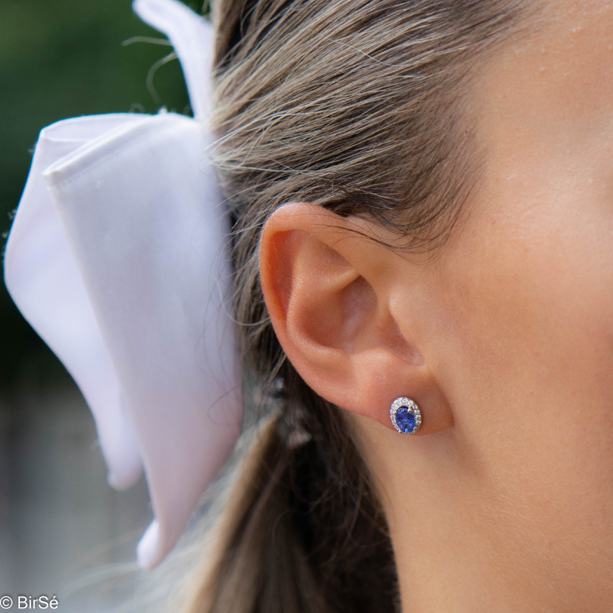 Royal vision - stunning silver earrings with a spectacular look and stud fastening. An elegant composition made of a fine combination of rhodium-plated silver with exquisite tanzanite and dazzling zircons.