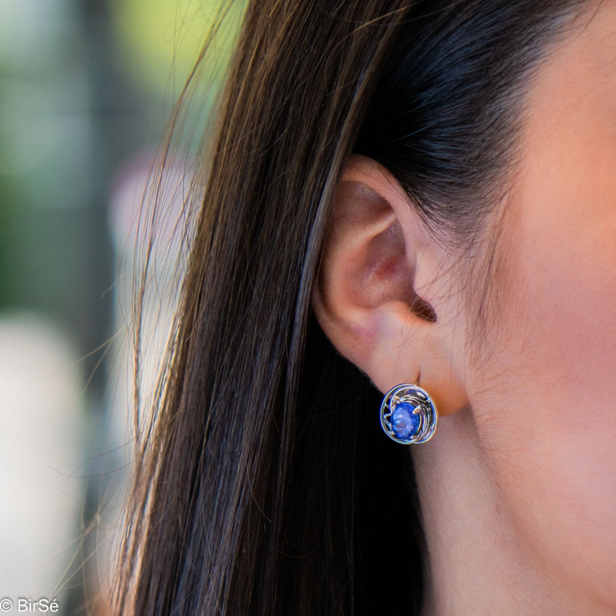 Sophisticated ladies' earrings, beautifully crafted from rhodium-plated silver, wrapped in a gentle embrace of enchanted tanzanite. Can be combined with a ring and pendant from the same collection.