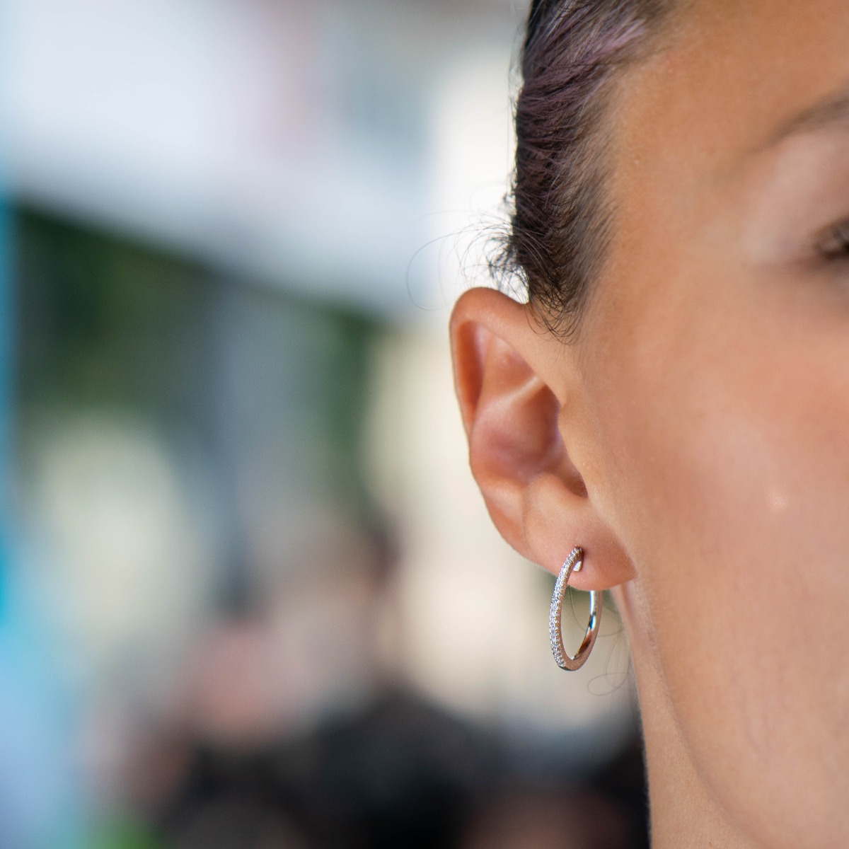 Elegant earrings in beautiful rhodium silver hoops with delicate sparkling zircons and pin fastening.