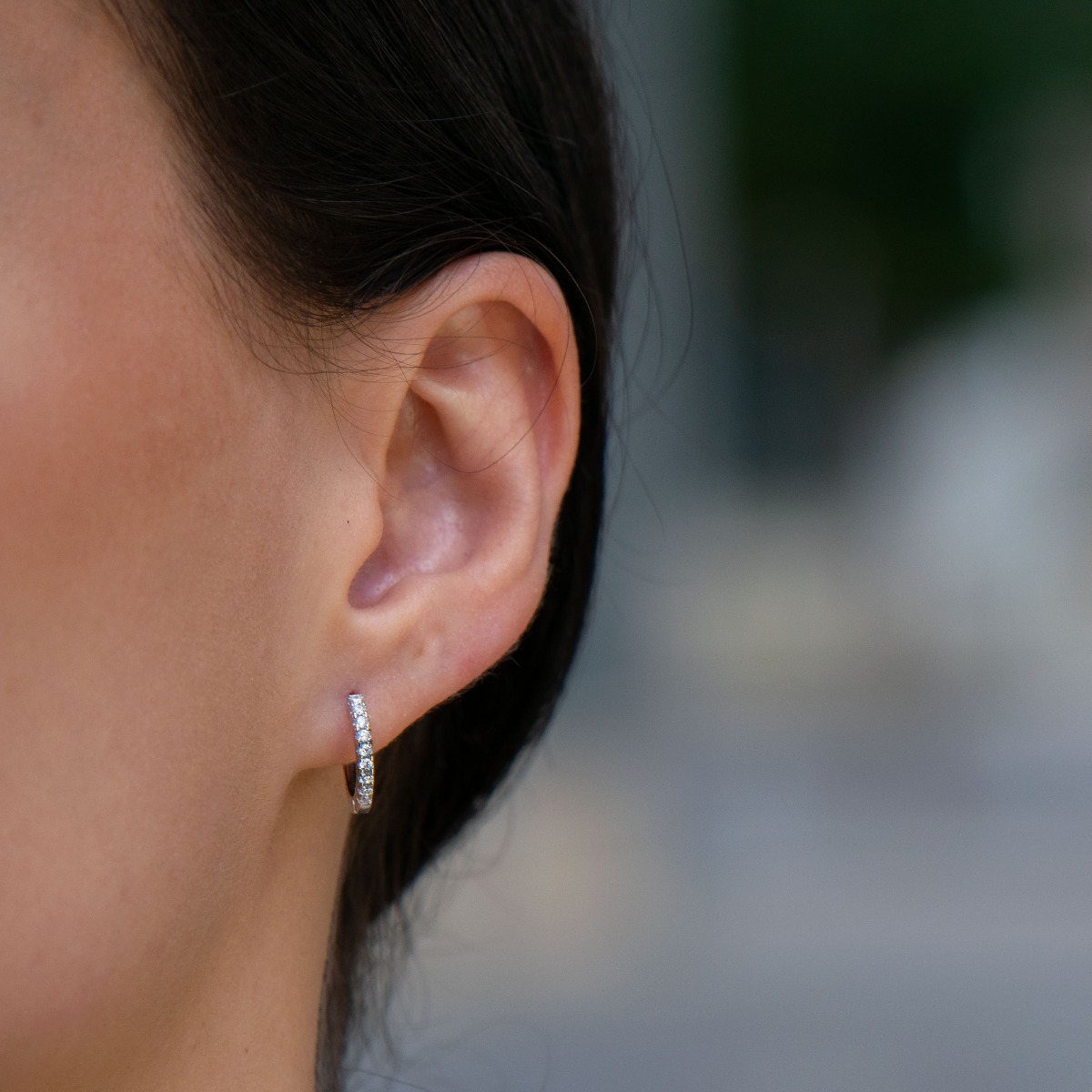 Small elegant silver earrings - rings, entirely made of rhodium-plated silver, decorated with sparkling zircons. The fastening is extremely comfortable and suitable for small children as well.