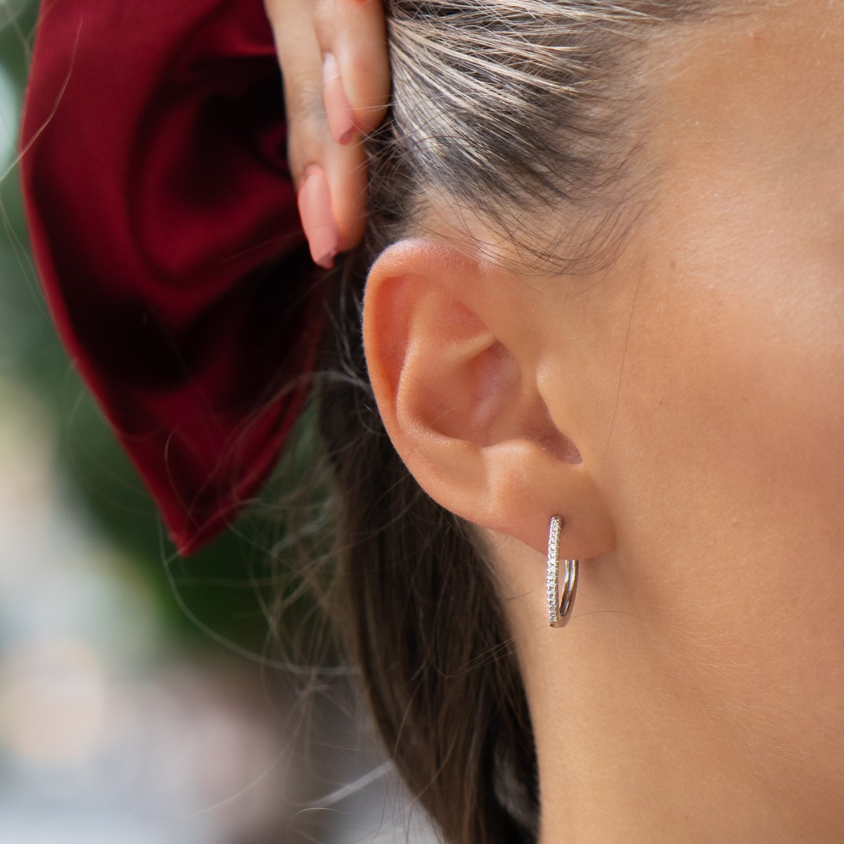 A stylish model of women's earrings - rings, with an elegant design, completely formed by combining rhodium-plated silver with shiny zircons. The fastening is English - comfortable and practical. A wonderful mood for your everyday life with BirSe earrings