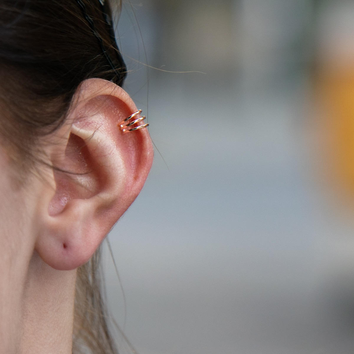 Modern women's cartilage earrings with delicate curves and crafted entirely in sparkling rose silver. For ladies who like different styles in jewelry.