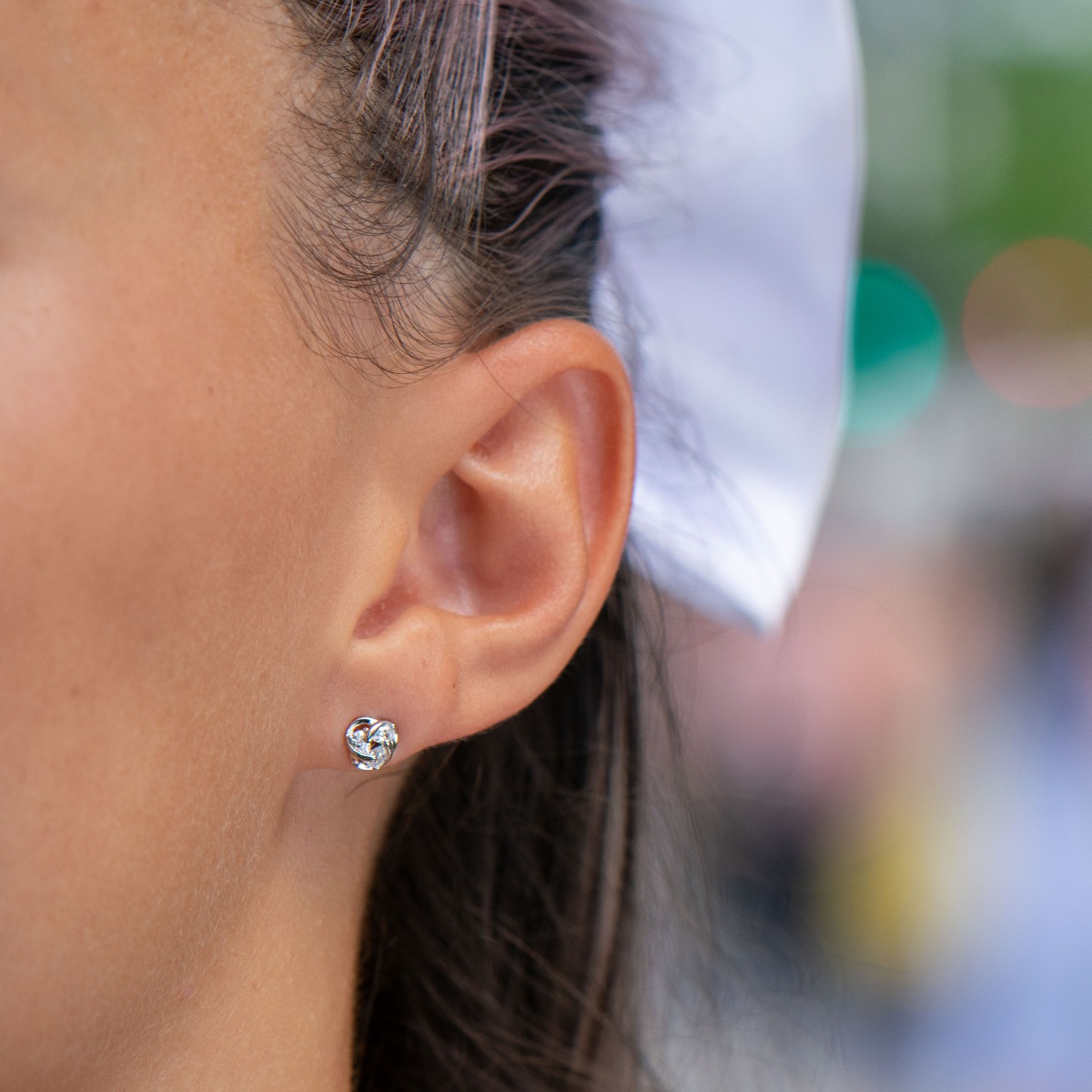 Silver earrings "Kozunacheta" - jewelry made with elegance and style, with beautiful braids of rhodium silver. Glistening zircons are inserted between the threads of fine silver. Suitable for any occasion.