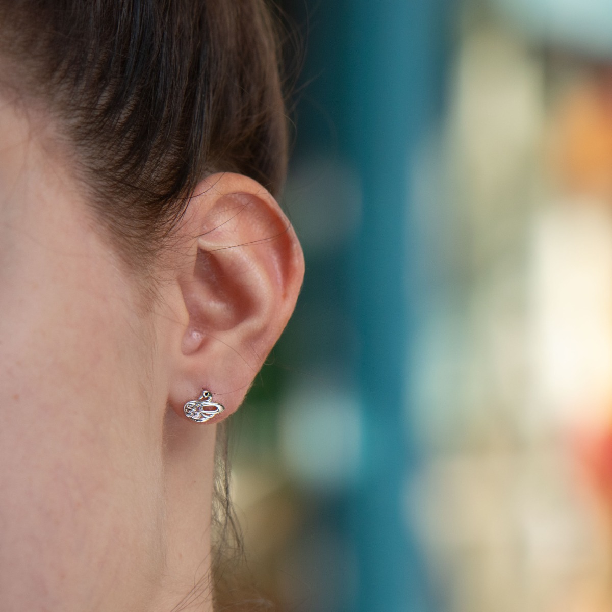 Elegant women's earrings made entirely of beautiful rhodium silver of a small charming bird. The added dazzling zircon make the jewelry even more charming.