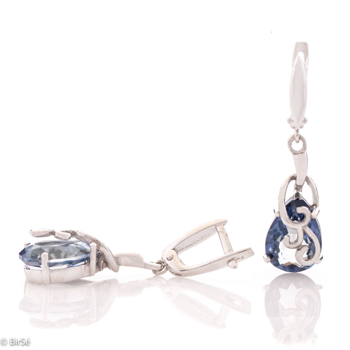 Spectacular pendant earrings with English clasp and delicate curves of beautiful rhodium silver, exquisite craftsmanship complemented by the glow of a unique natural blue mystic topaz stone.