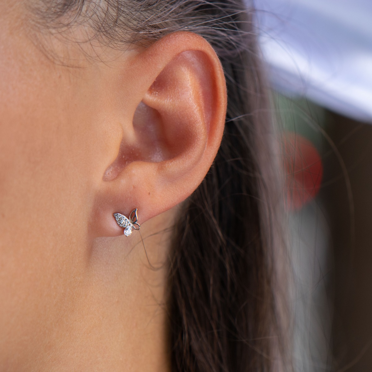 Charming earrings in soft rhodium silver in the shape of a butterfly encrusted with zircons. The earrings are suitable for children and young girls. Pin fastening is comfortable and secure.