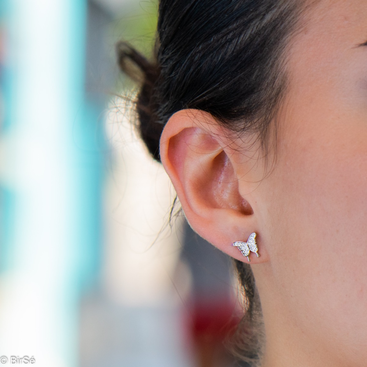 Captivating ladies' butterfly earrings. They are made entirely of rhodium-plated silver and have a convenient pin fastening. They can be combined with a pendant of the same model. Encrusted with sparkling zircons, these earrings make a wonderful gift for 