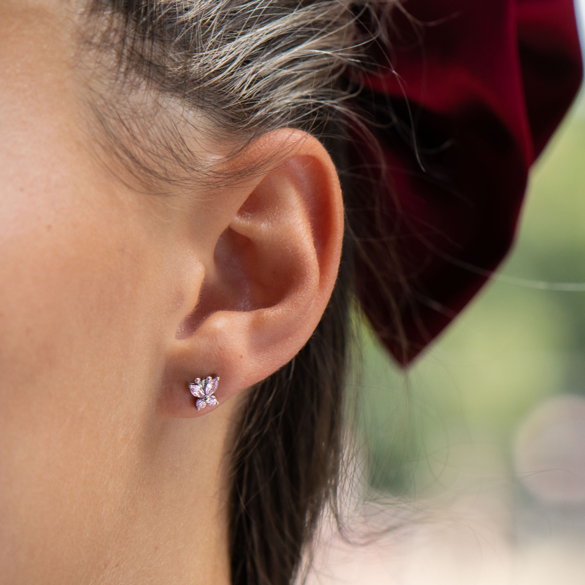 Charming earrings in fine rhodium silver, with delicate precision craftsmanship and an extremely spectacular butterfly pattern, decorated with dazzling zircons. Earrings are a suitable piece of jewelry for a daily outfit or a more special occasion.