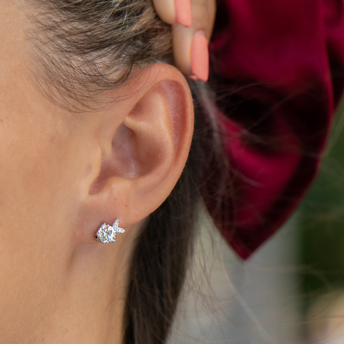 Charming sterling silver Fish earrings crafted with exquisite designs of glittering zircons elements. The fastening is with a pin - secure and preferred by the ladies.